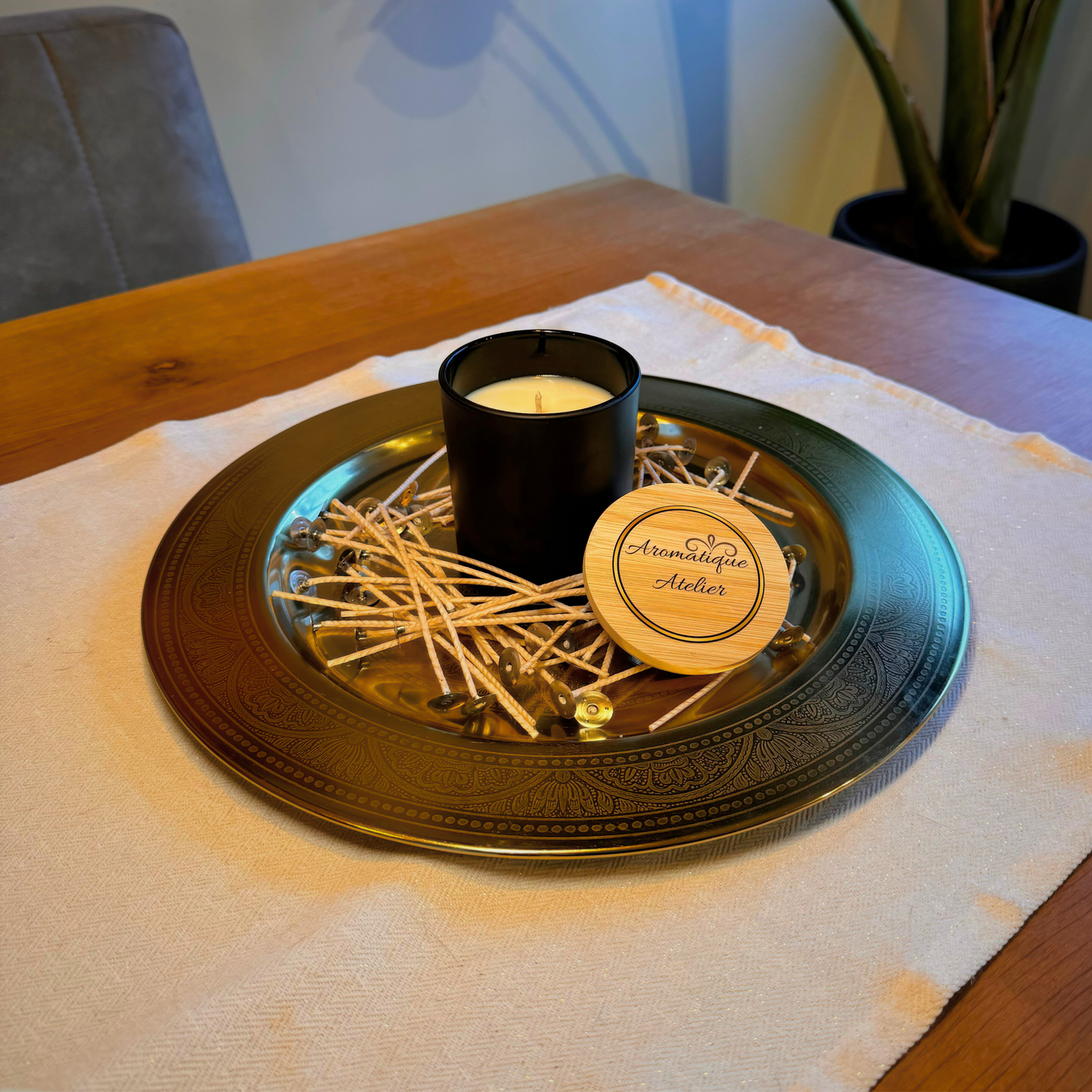47+H Premium Candle - The One Inspired on a decorative tray with matches.