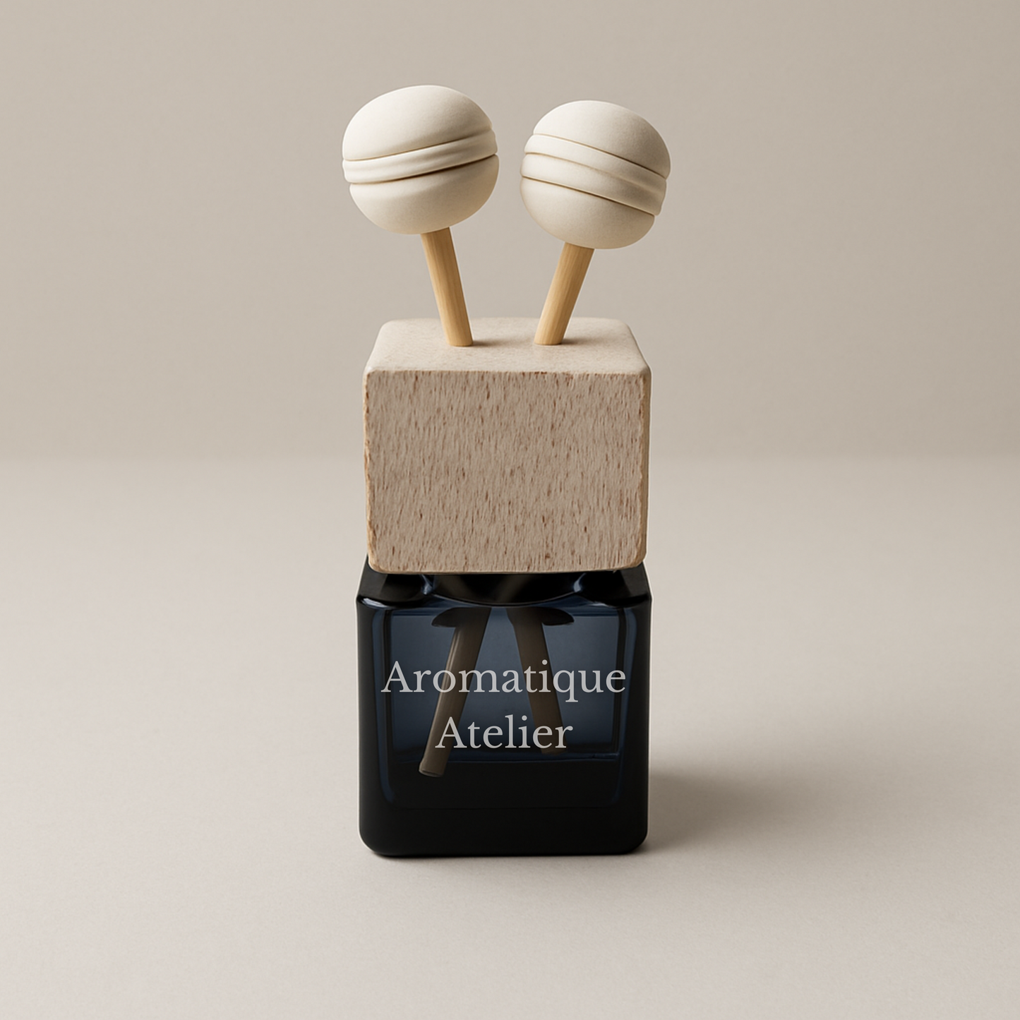 Classic vent clip car perfume by Aromatique Atelier with minimalist wood and black glass design