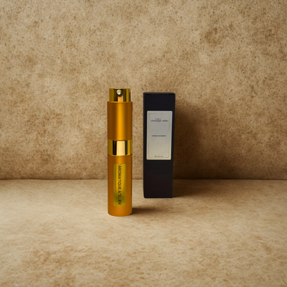 Aromatique Atelier Travel Perfume 10ML bottle with black packaging on beige background