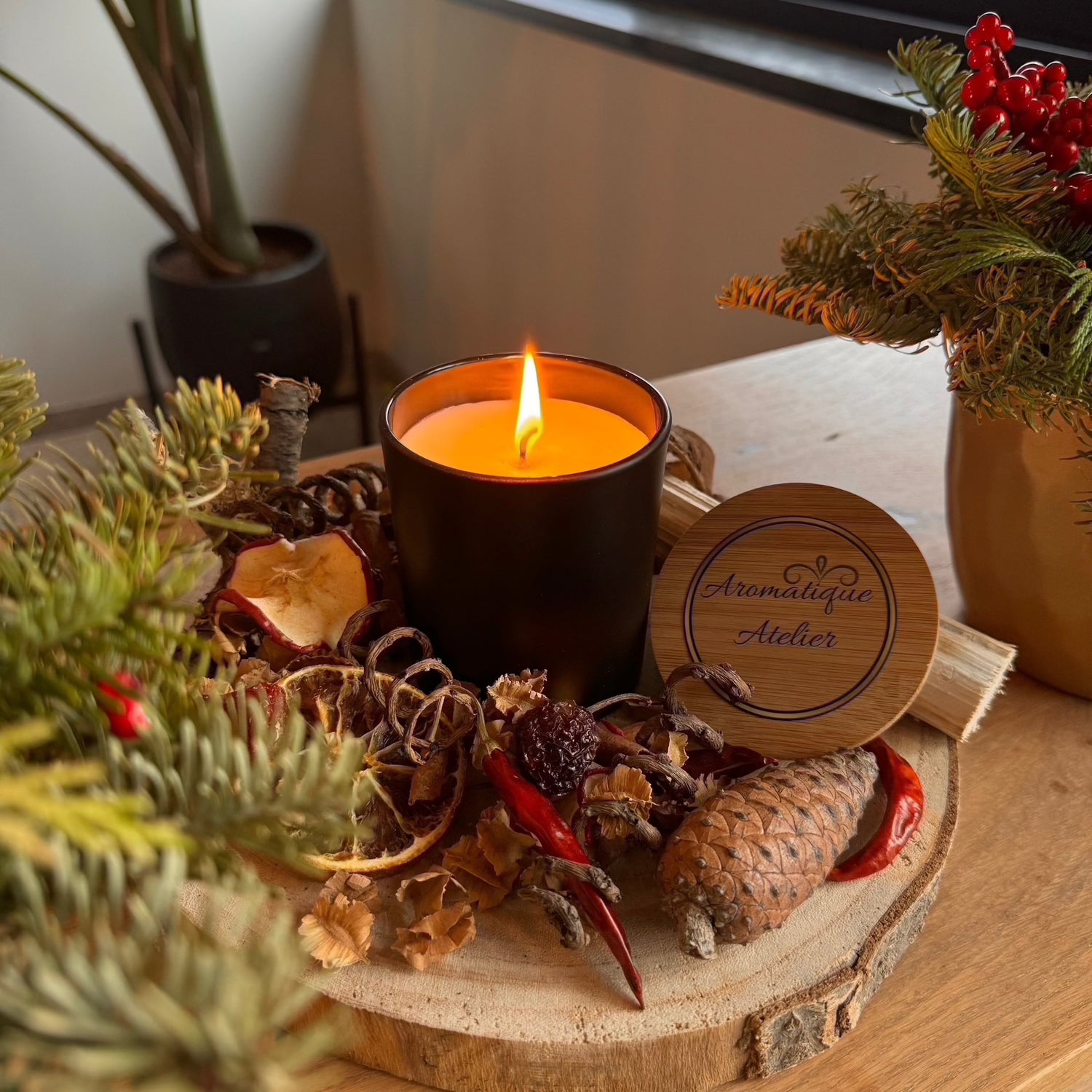 47+H Premium Candle - The One Inspired in a cozy setting with natural decor, offering a fresh citrus and warm aromatic scent.